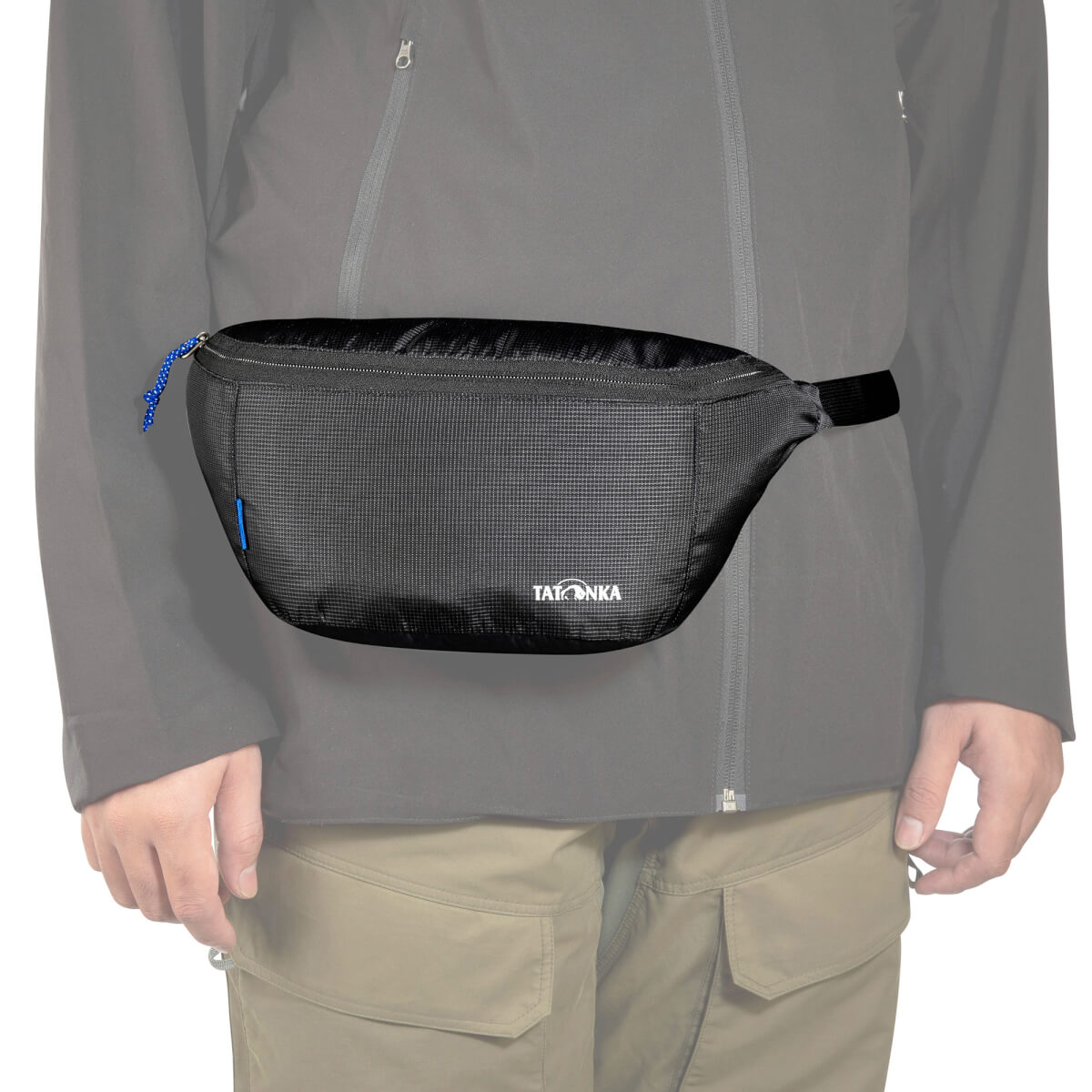 Front view of person wearing a Tatonka Ilium bum bag with zip main compartment and adjustable hip belt - Black