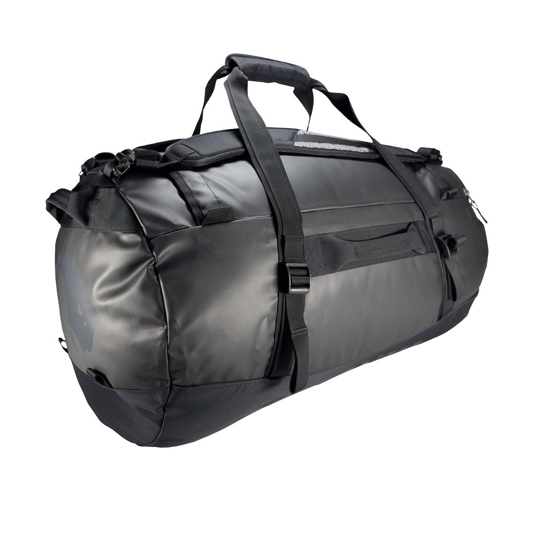 Back three-quarter view of 130 litre Tatonka barrel bag with adjustable, top carry handles, grab handles on all sides, and padded, removable and adjustable backpack shoulder straps. Main body has compression straps and a padded bottom - Black