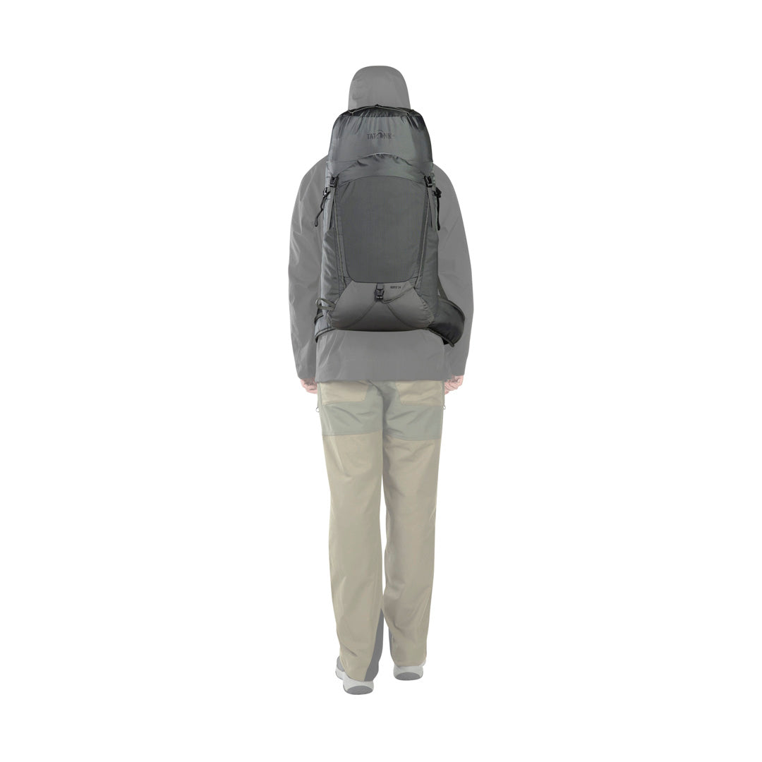 Back view of person wearing the 34 litre Tatonka Norix pack with detachable padded hip belt in place - Titan Grey