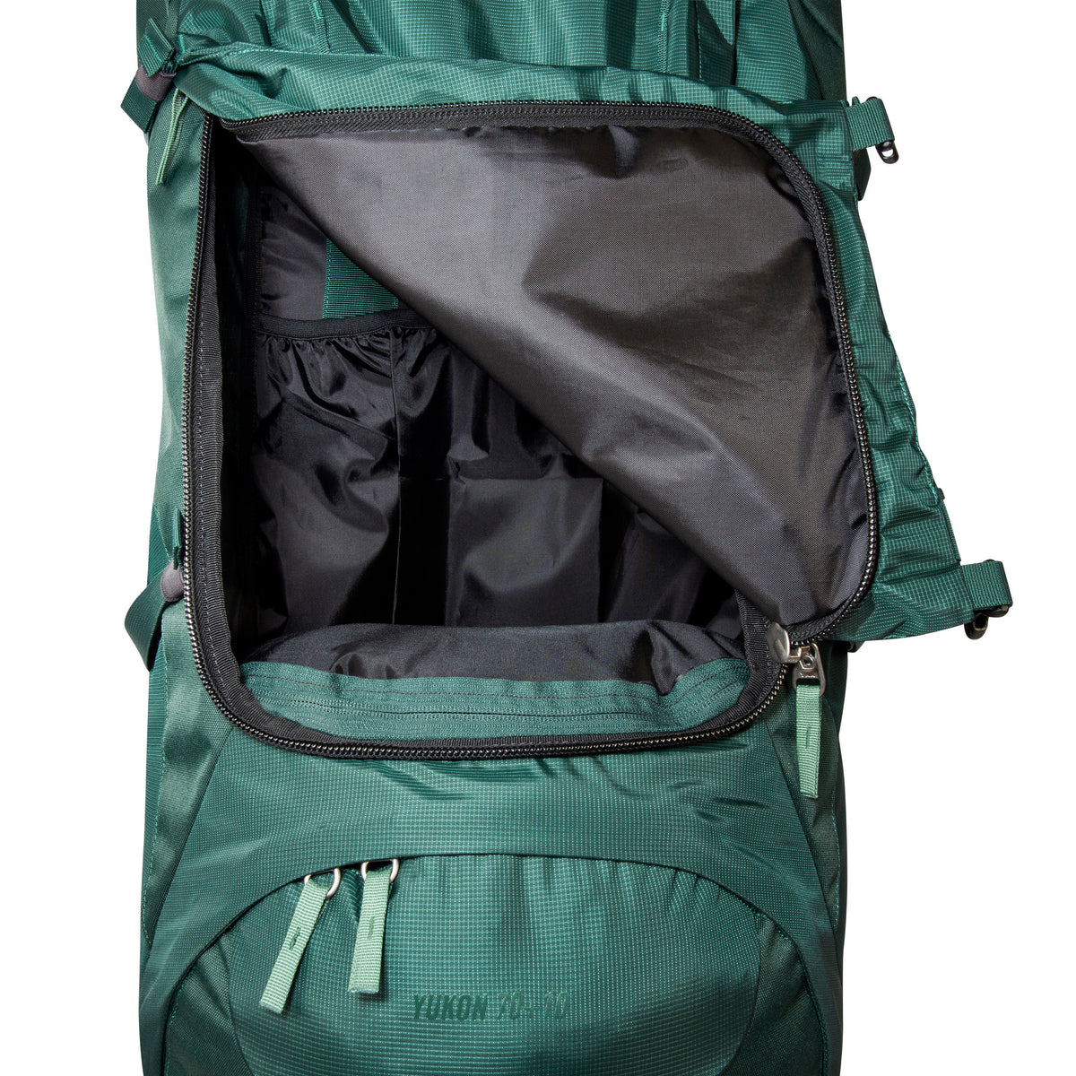 Close up of 3D zip front opening for main compartment on 70/10 litre Tatonka branded Yukon pack. Shown with compartment half unzipped - Jasper