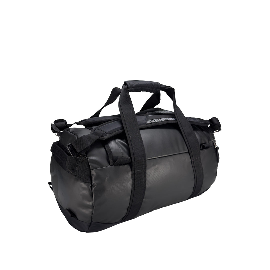 Back three-quarter view of 25 litre Tatonka barrel bag with adjustable, top carry handles, grab handles on both ends, and padded, removable and adjustable backpack shoulder straps. Main body has compression straps and a padded bottom - Black
