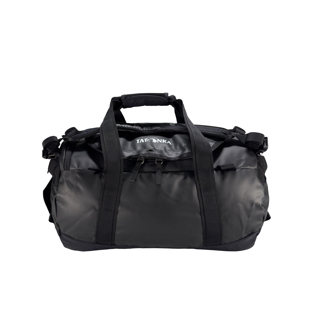 Front view of 25 litre Tatonka barrel bag with adjustable, top carry handles, grab handles on both ends, and padded, removable and adjustable backpack shoulder straps. Main compartment top opening has 2-way lockable zip sliders, while main body has compression straps and a padded bottom - Black | Ships from Melbourne