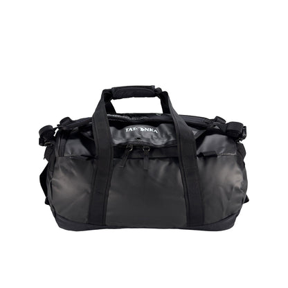 Front view of 25 litre Tatonka barrel bag with adjustable, top carry handles, grab handles on both ends, and padded, removable and adjustable backpack shoulder straps. Main compartment top opening has 2-way lockable zip sliders, while main body has compression straps and a padded bottom - Black | Ships from Melbourne