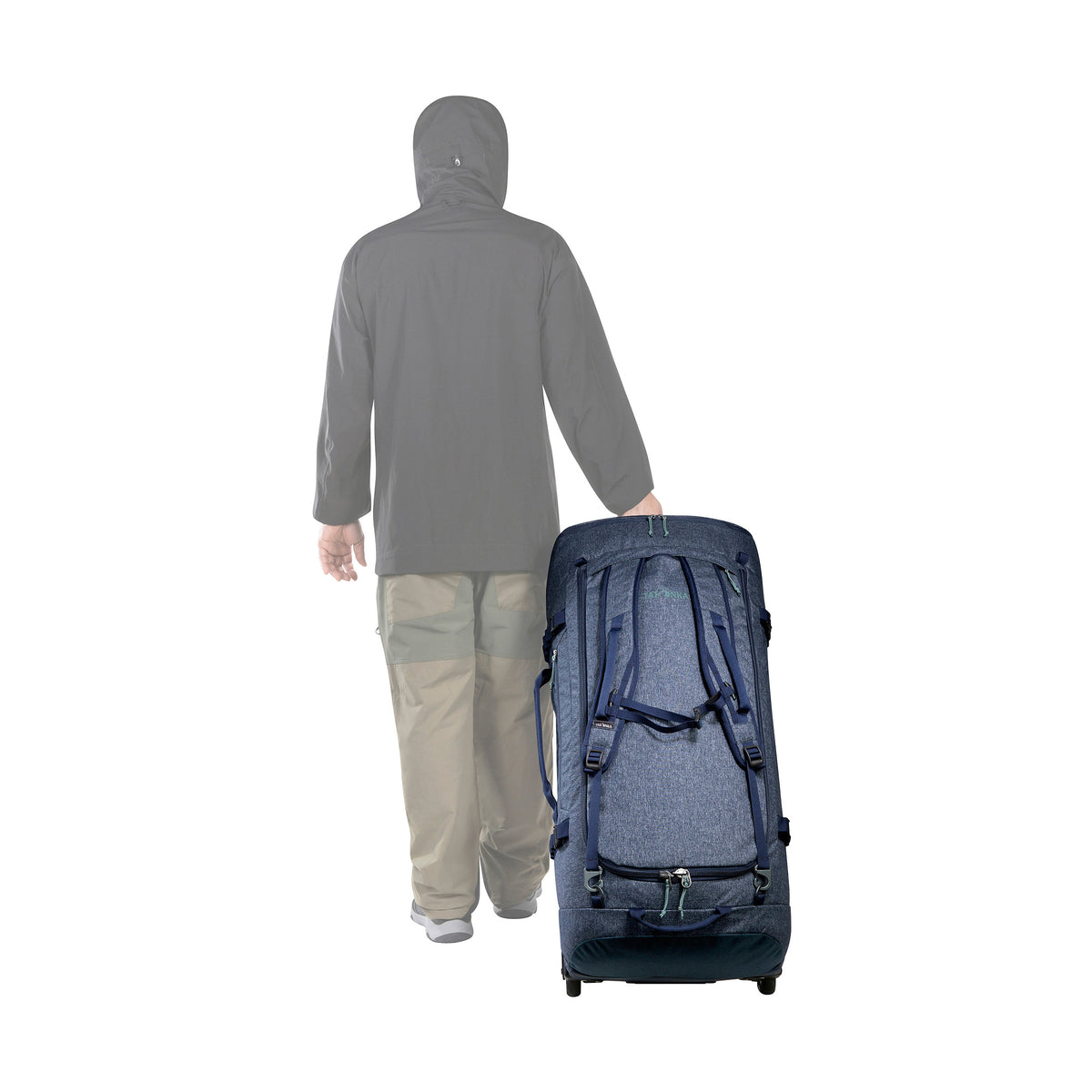 Artist's impression of person pulling a Tatonka Duffel Roller - Navy