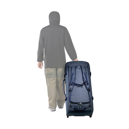 Artist's impression of person pulling a Tatonka Duffel Roller - Navy