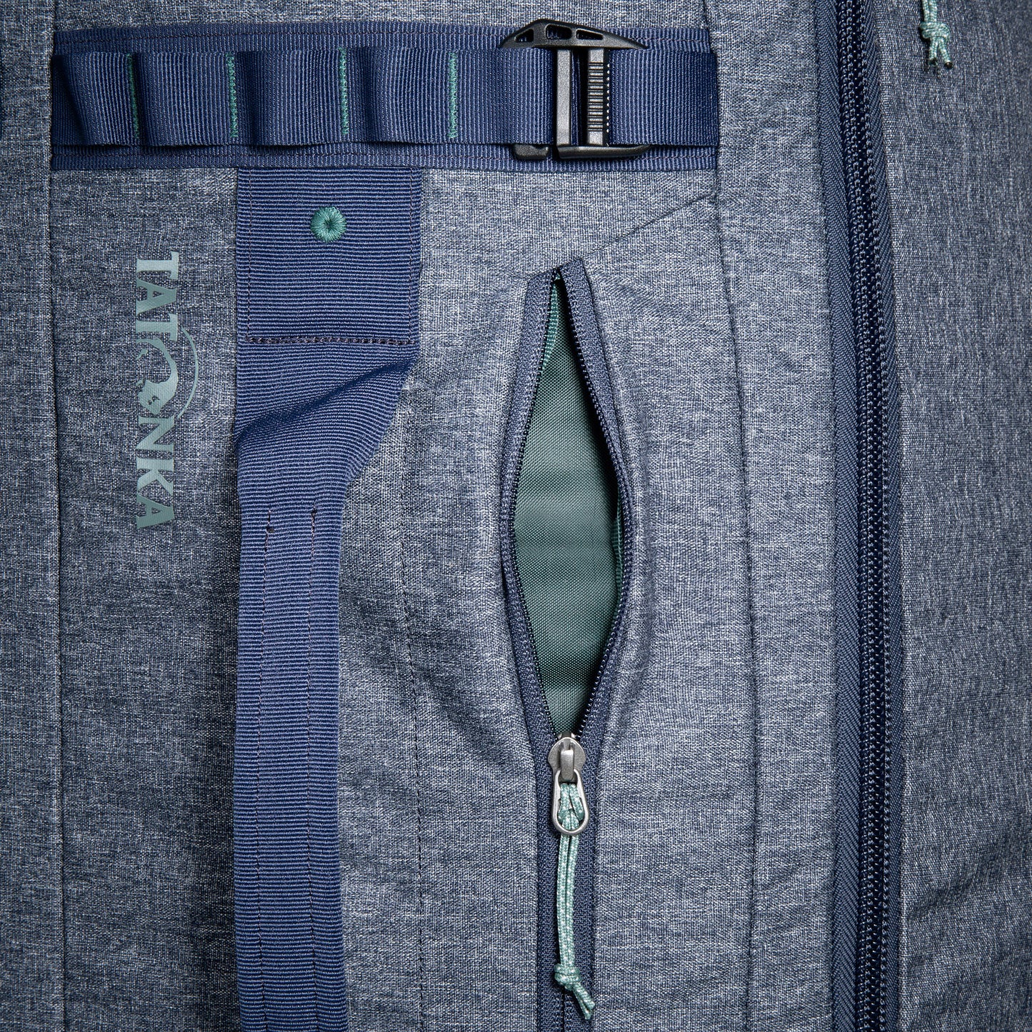 Close up of the size zip pocket on a Tatonka Duffel Roller - Navy