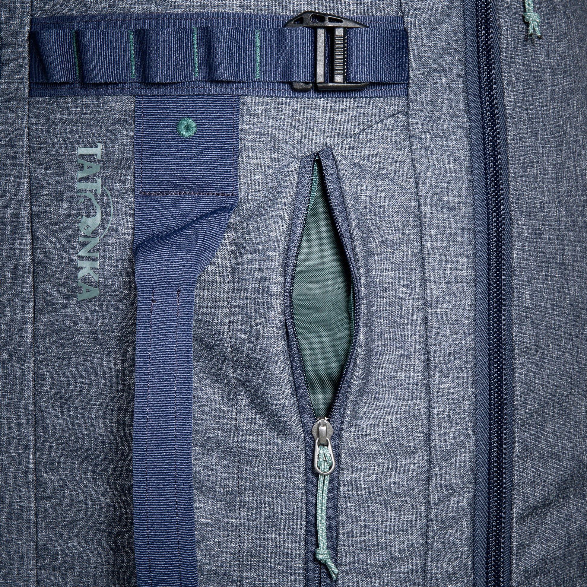 Close up of the size zip pocket on a Tatonka Duffel Roller - Navy
