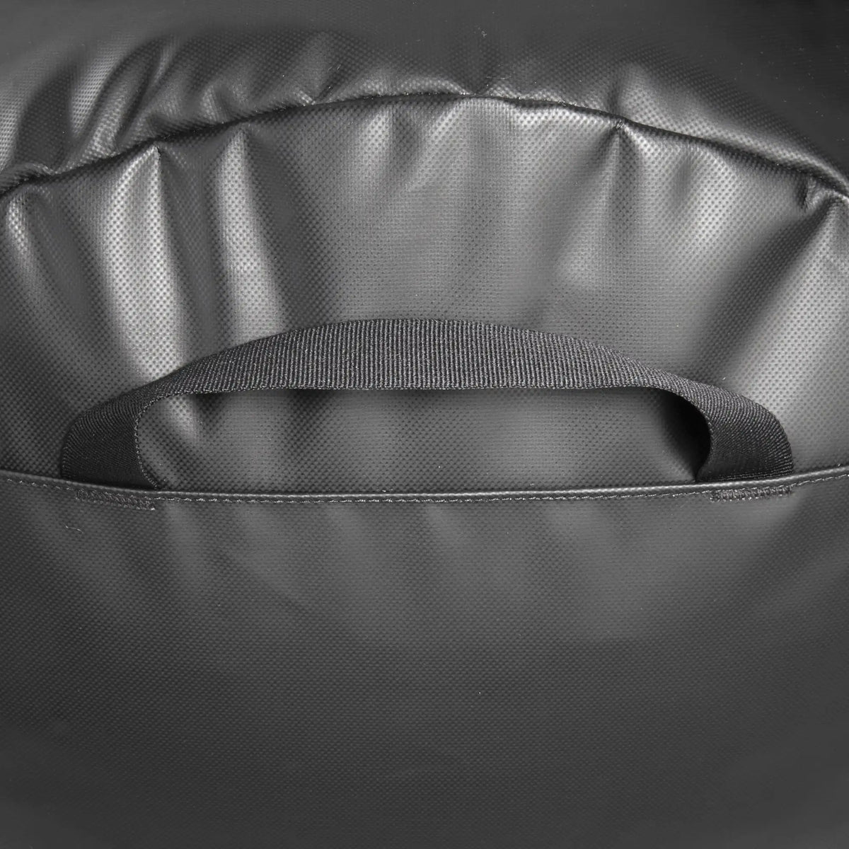 Close-up of the end handle of the Tatonka Basic Barrel 85 L in matte black | TADI.6982.408